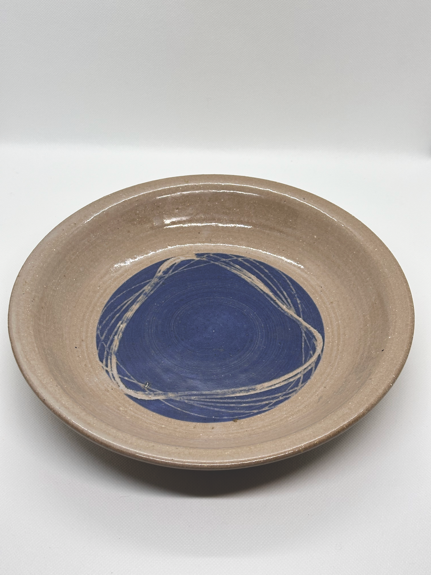 Jugtown pie plate in blush and denim hues